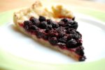 A slice of black raspberry tart